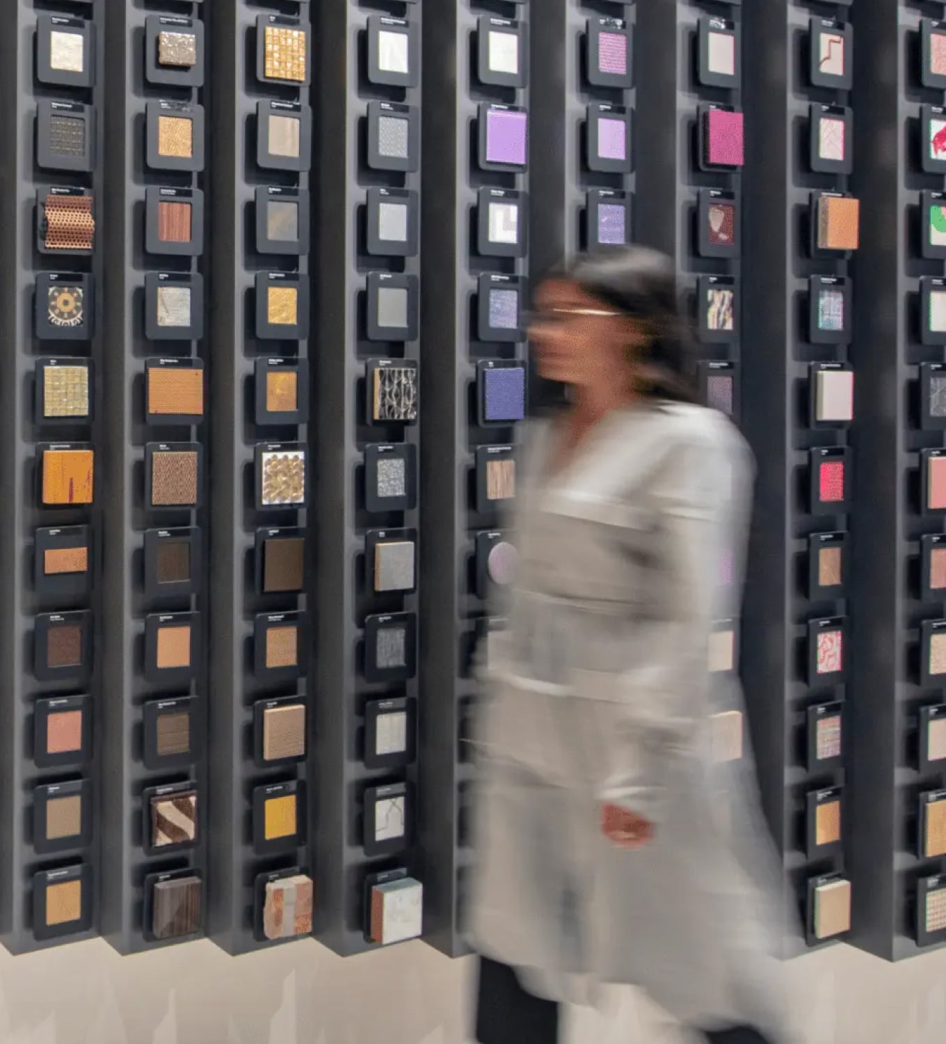 Woman passing the material wall
